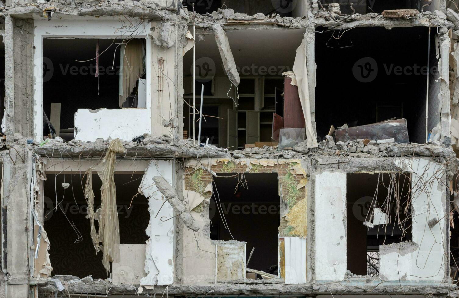 destroyed and burned houses in the city during the war in Ukraine photo