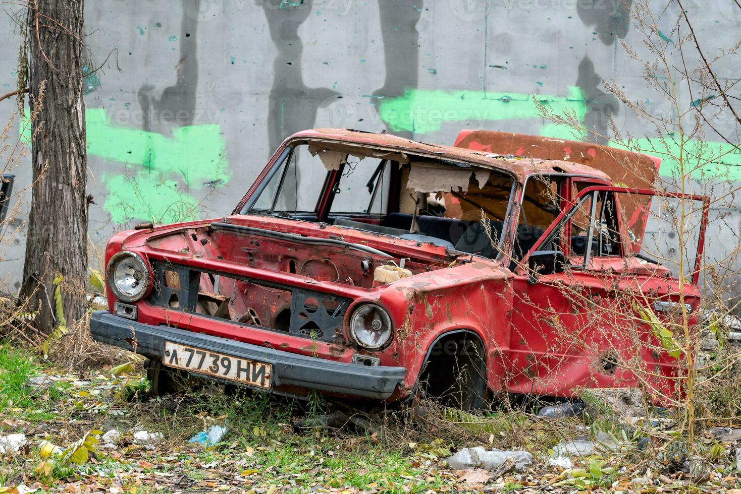 damaged and looted cars in a city in Ukraine during the war photo