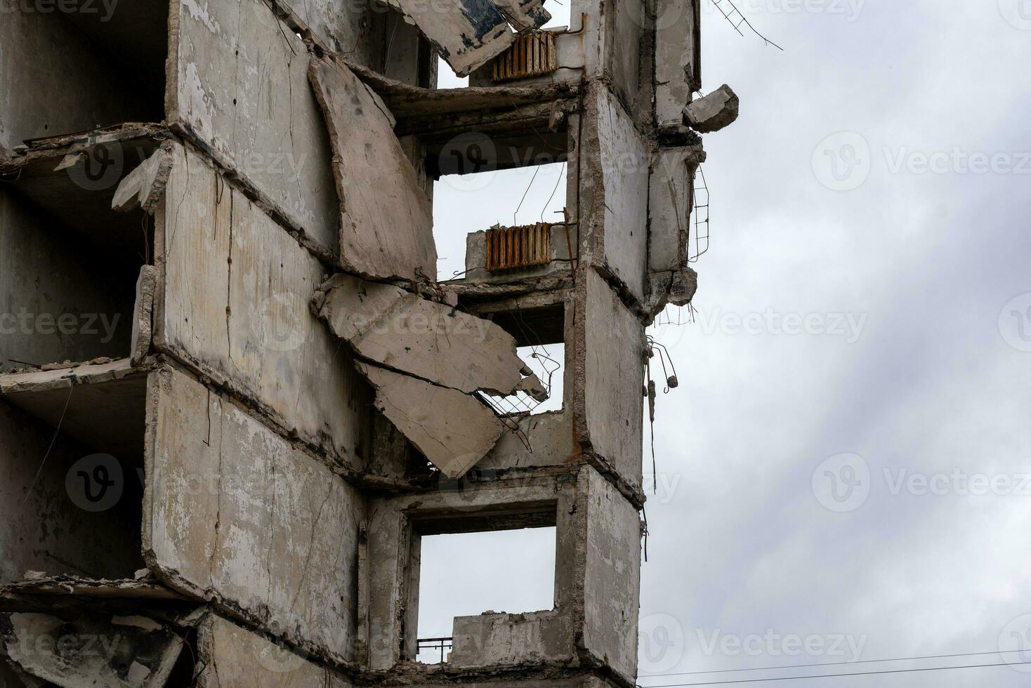 destroyed and burned houses in the city during the war in Ukraine photo