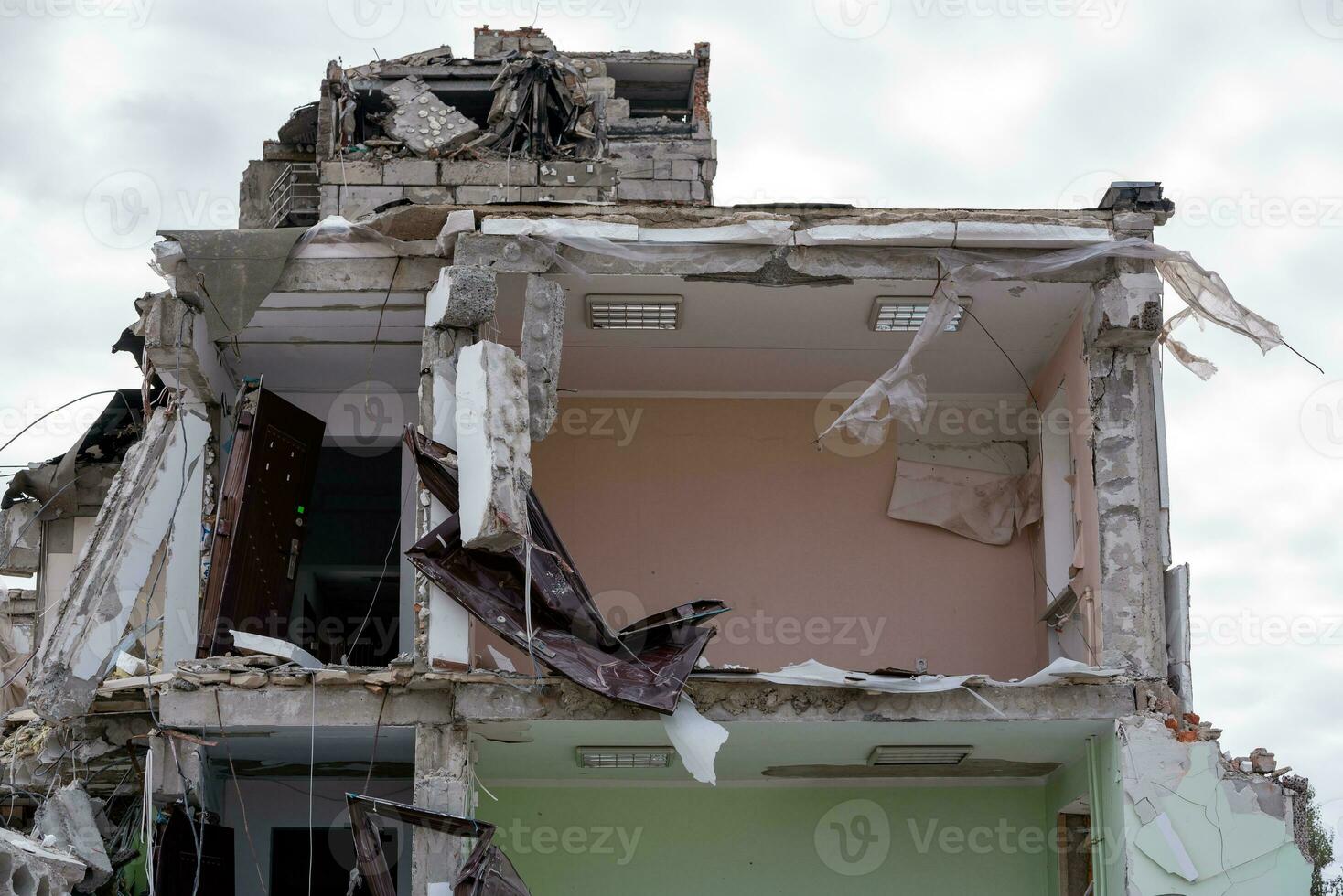 destroyed and burned houses in the city during the war in Ukraine photo