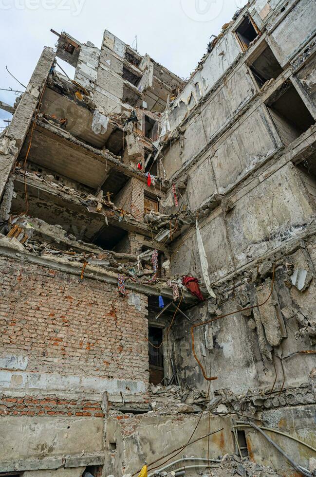 destroyed and burned houses in the city during the war in Ukraine photo