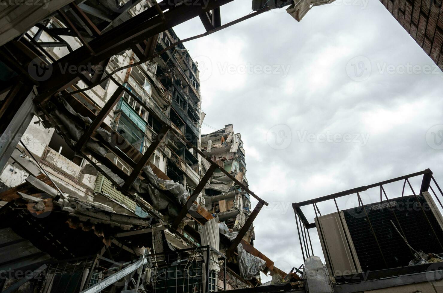 destroyed and burned houses in the city during the war in Ukraine photo