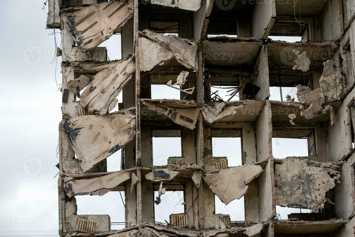 destroyed and burned houses in the city during the war in Ukraine photo