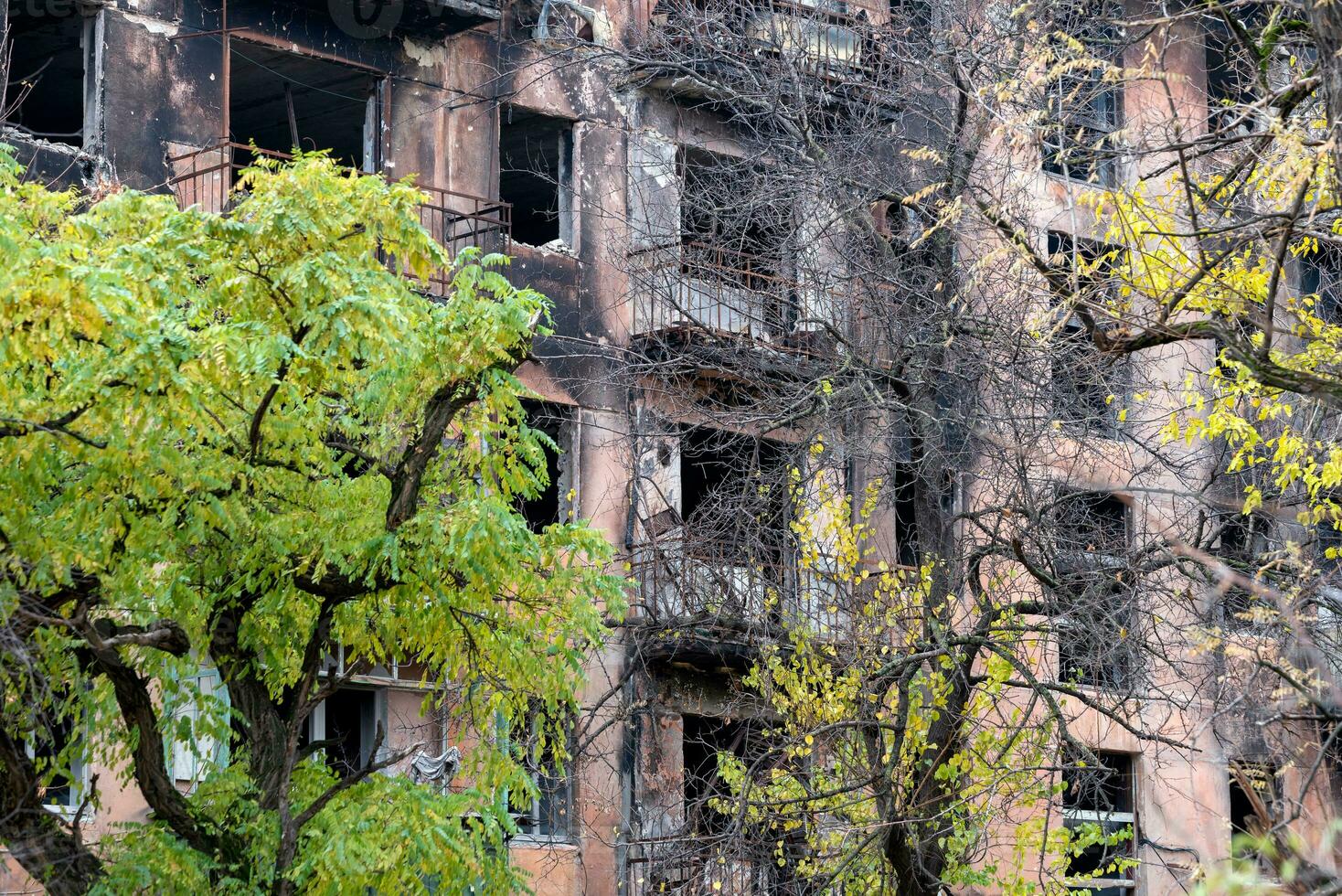 destroyed and burned houses in the city Russia Ukraine war photo