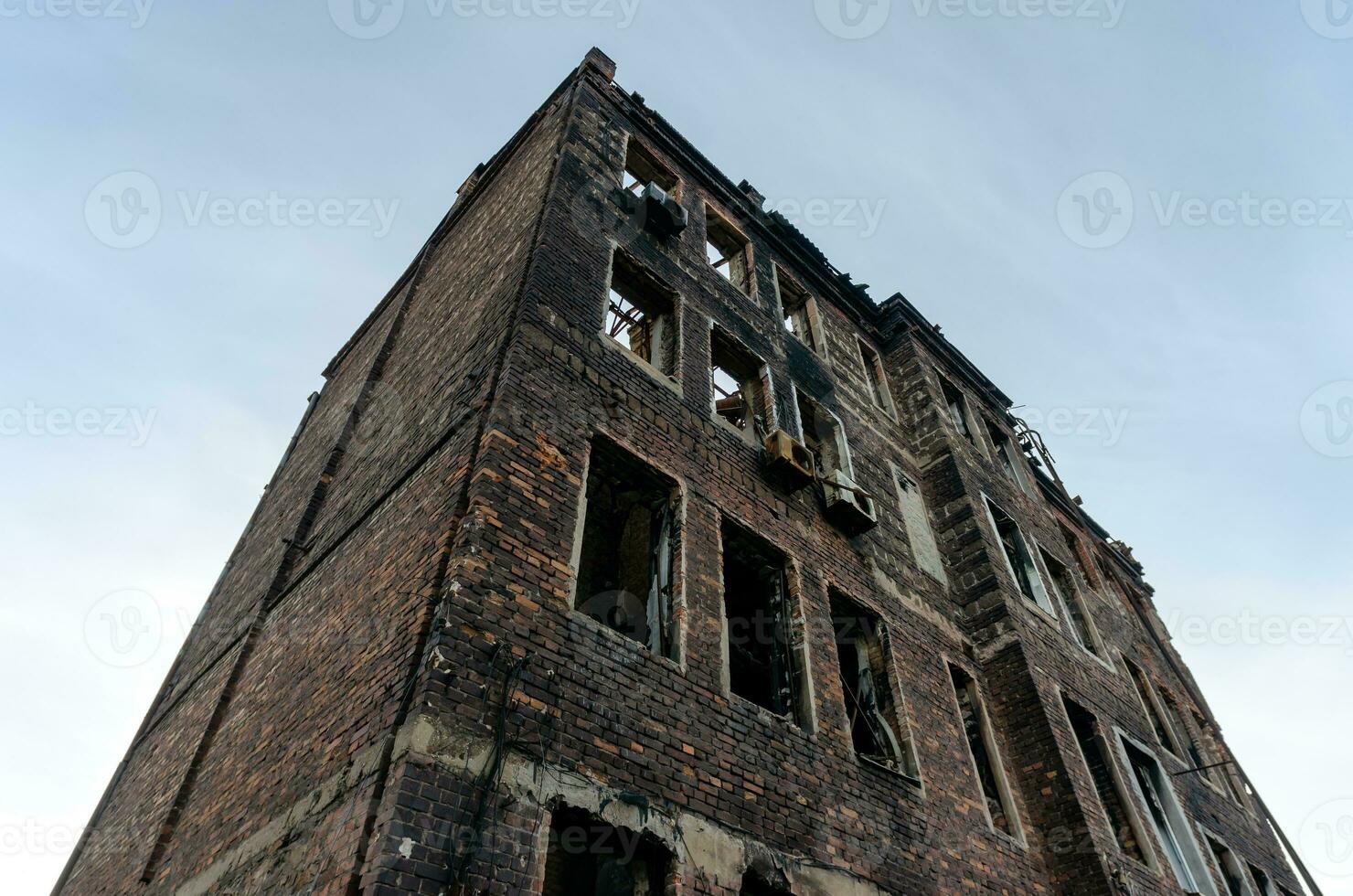 destroyed and burned houses in the city Russia Ukraine war photo
