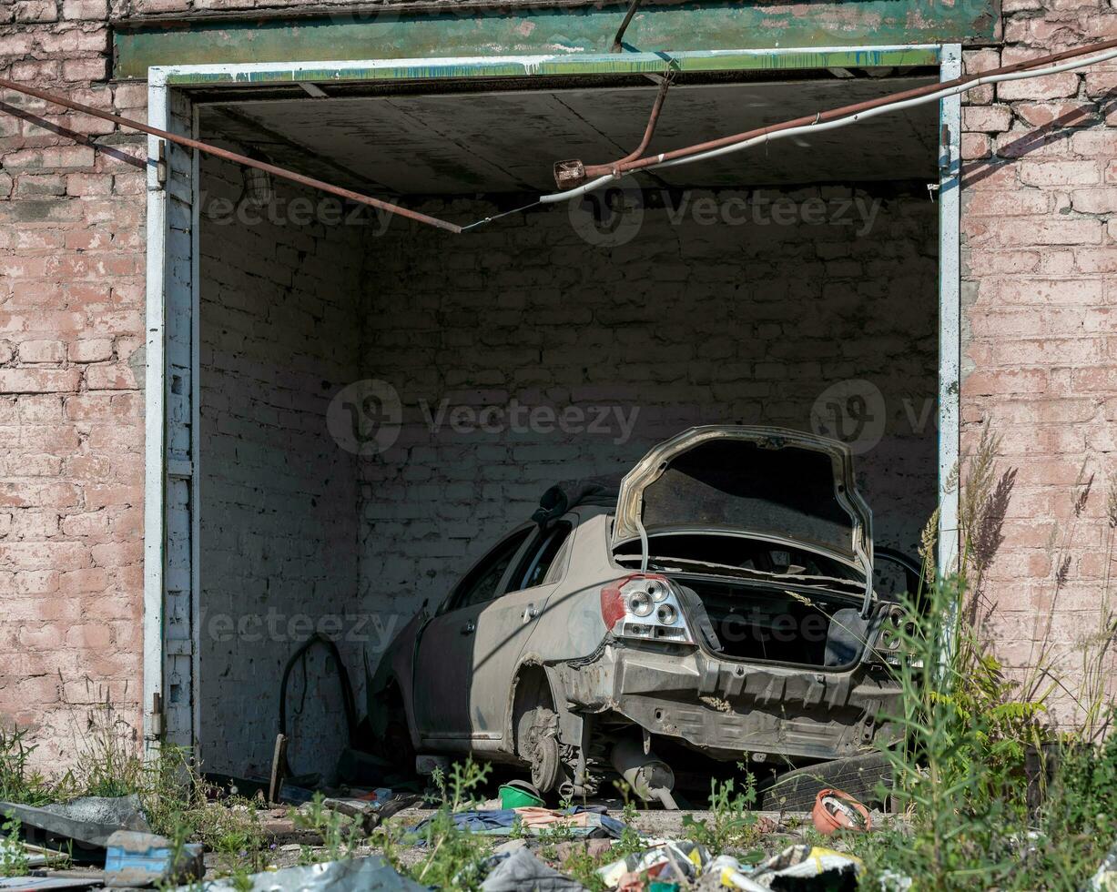 damaged and looted cars in a city in Ukraine during the war photo