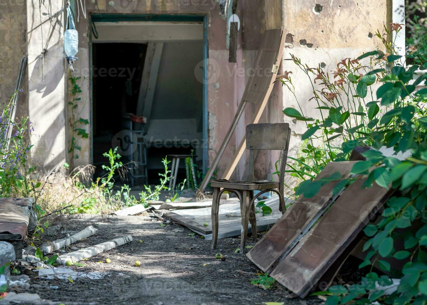 old broken door of a destroyed house in Ukraine photo