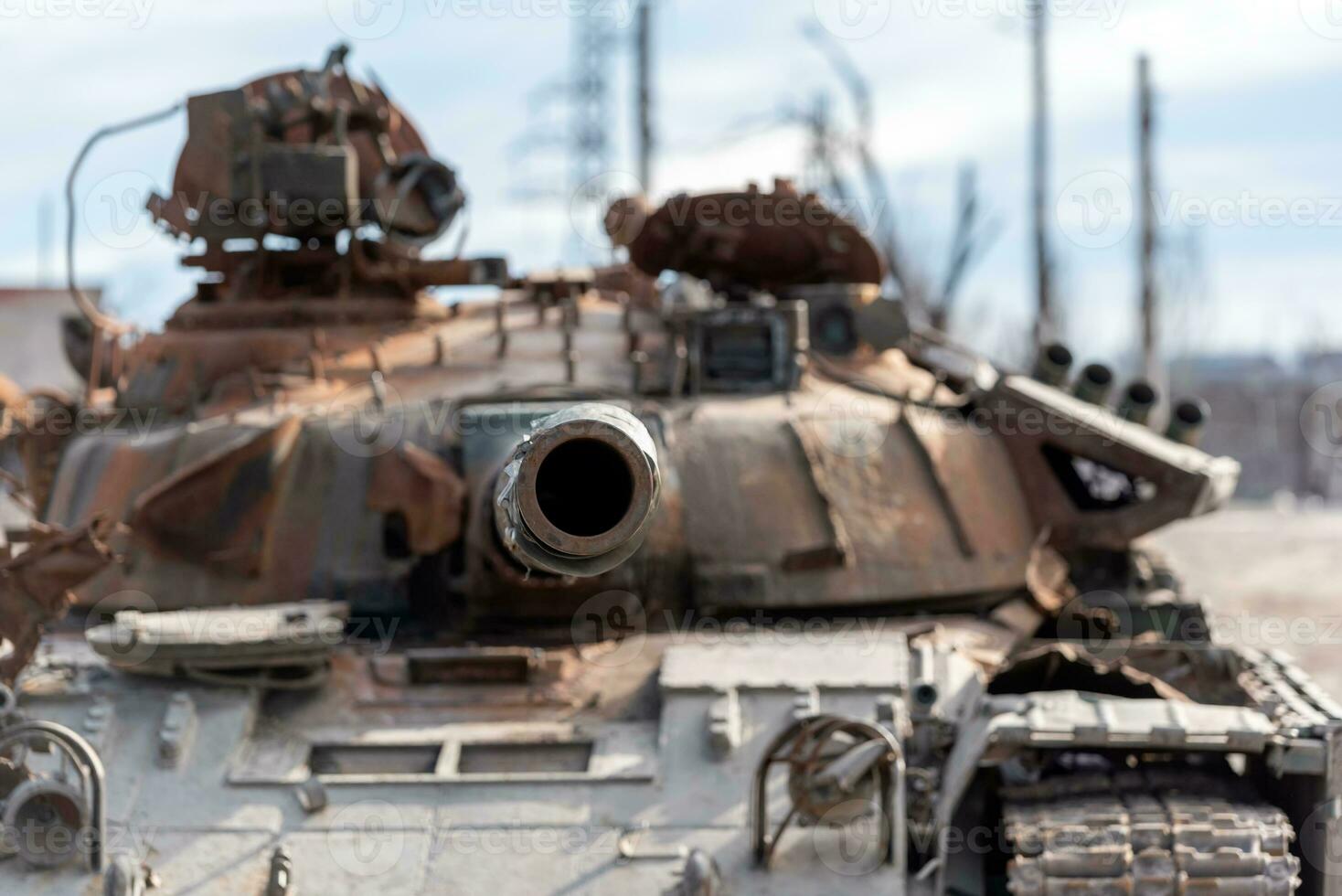 damaged military tank on a city street in Ukraine photo