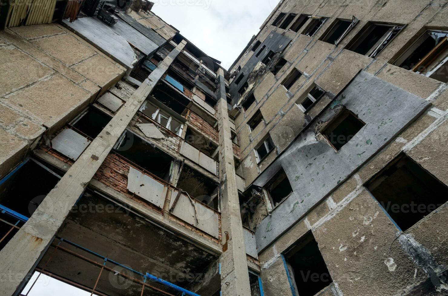 destroyed and burned houses in the city during the war in Ukraine photo