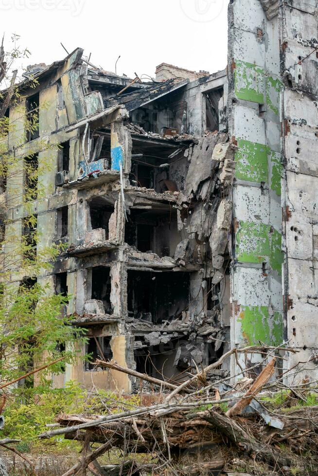 destroyed and burned houses in the city during the war in Ukraine photo