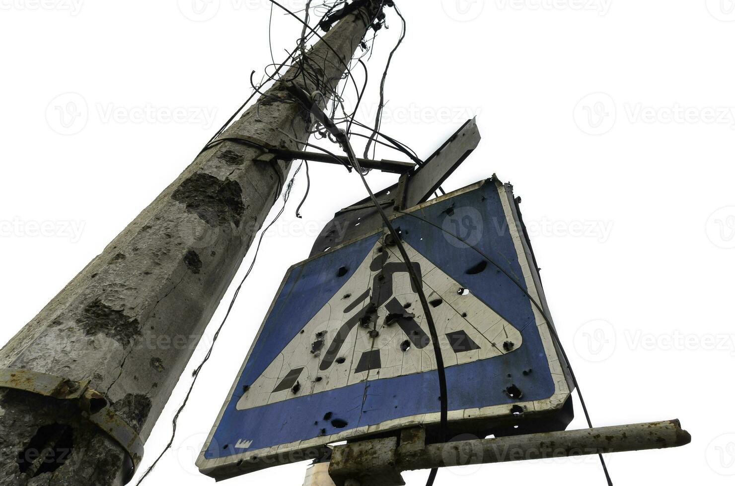 blue road sign and concrete pillar broken by shards isolated photo