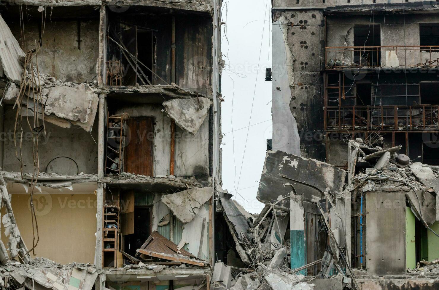 destroyed and burned houses in the city during the war in Ukraine photo