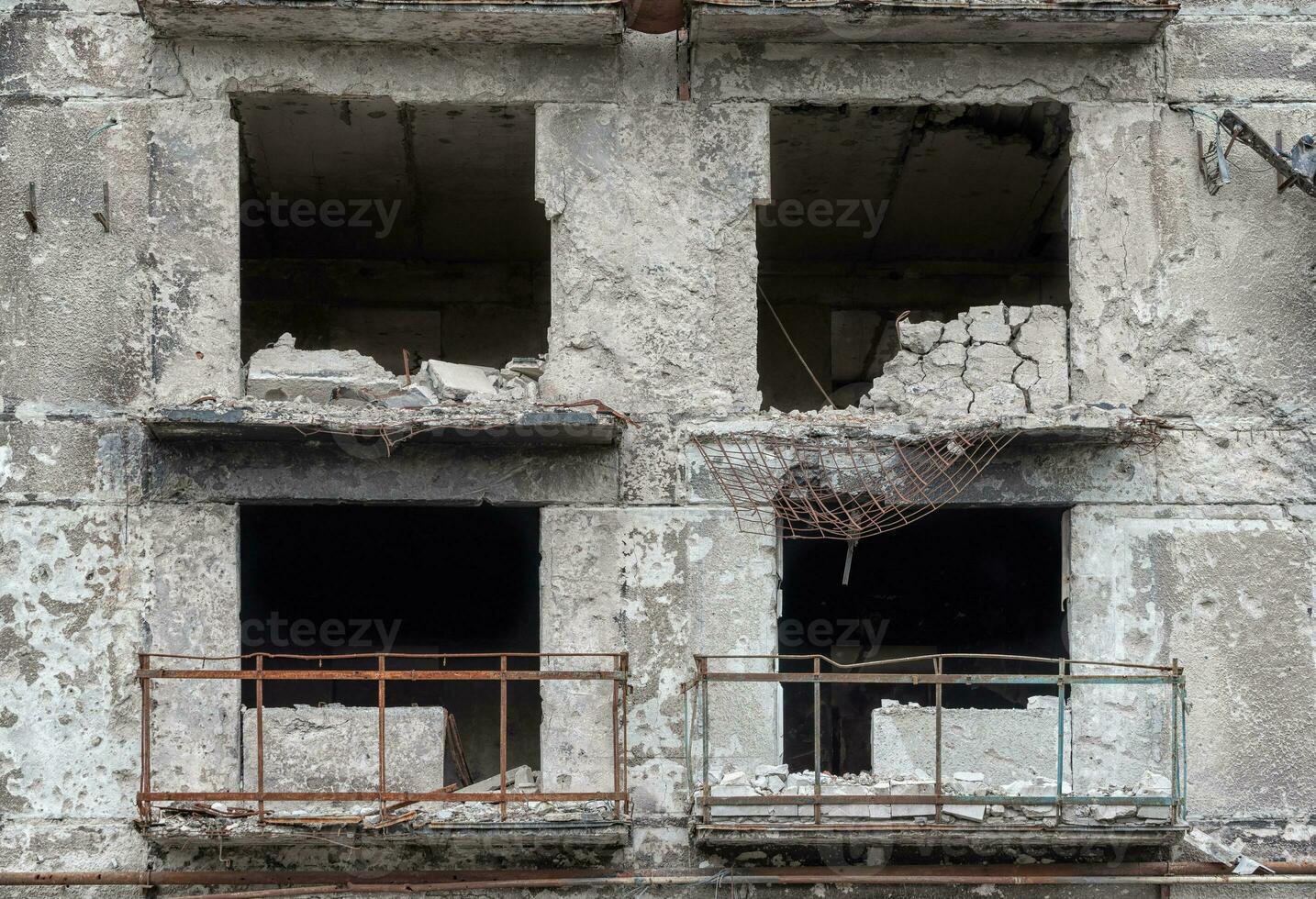 destroyed and burned houses in the city during the war in Ukraine photo