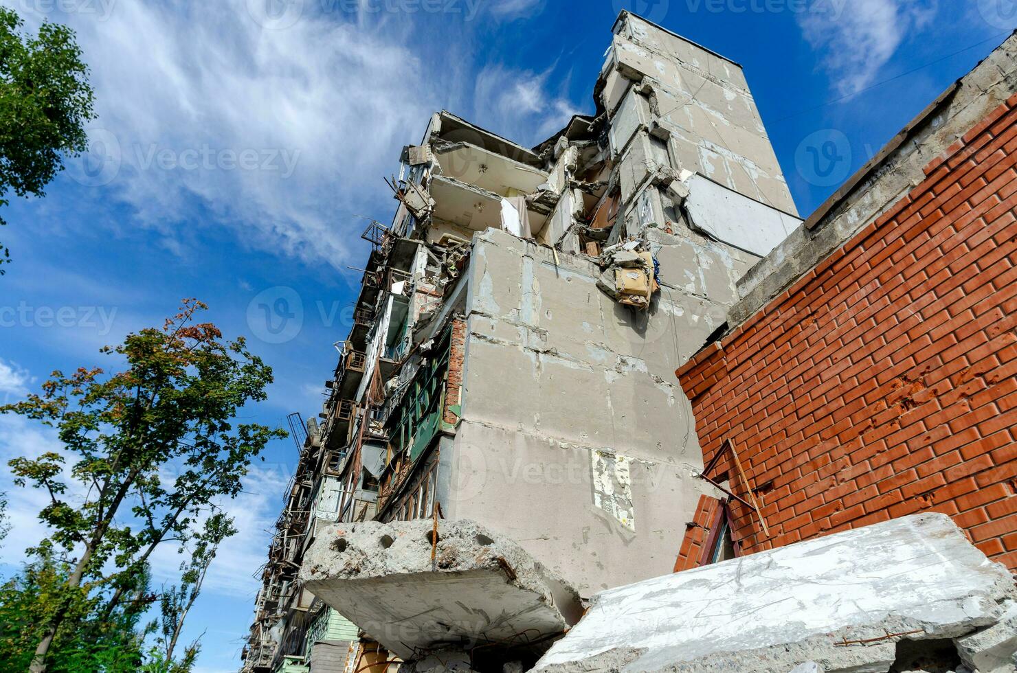 destroyed and burned houses in the city during the war in Ukraine photo