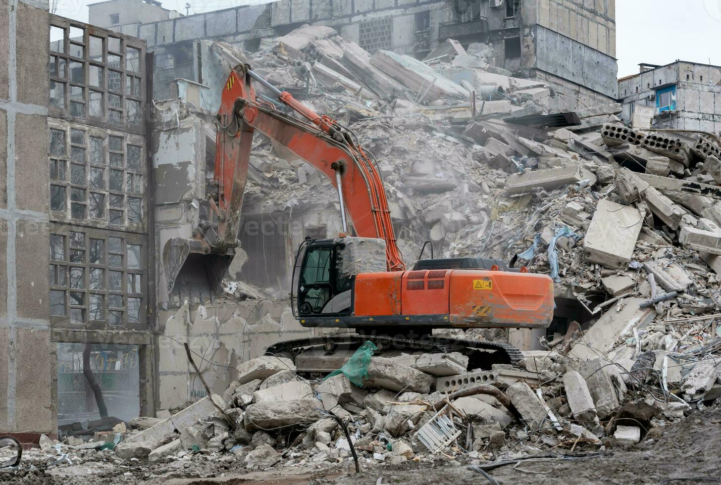 construction equipment destroys affected houses war in Ukraine photo