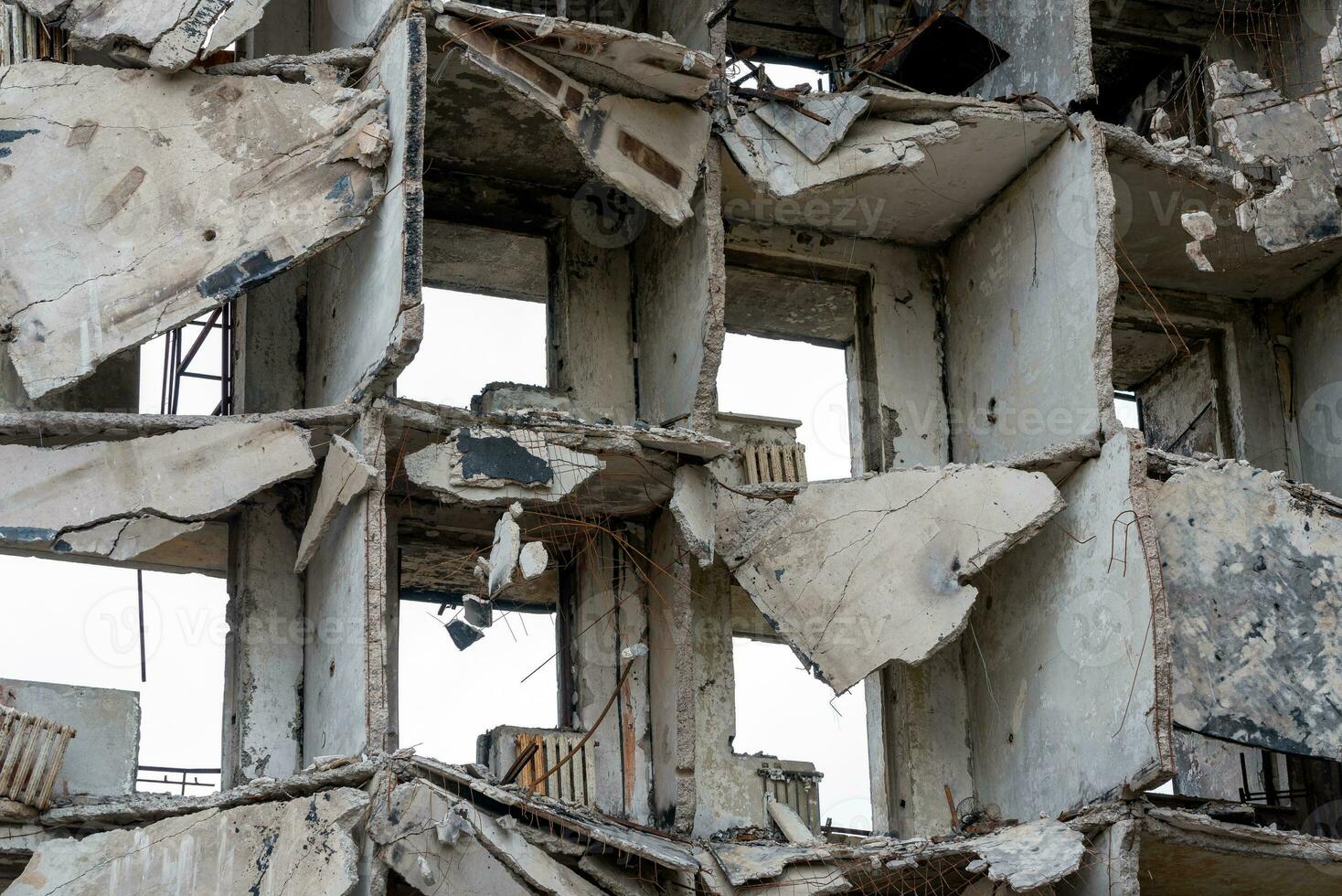 destroyed and burned houses in the city during the war in Ukraine photo