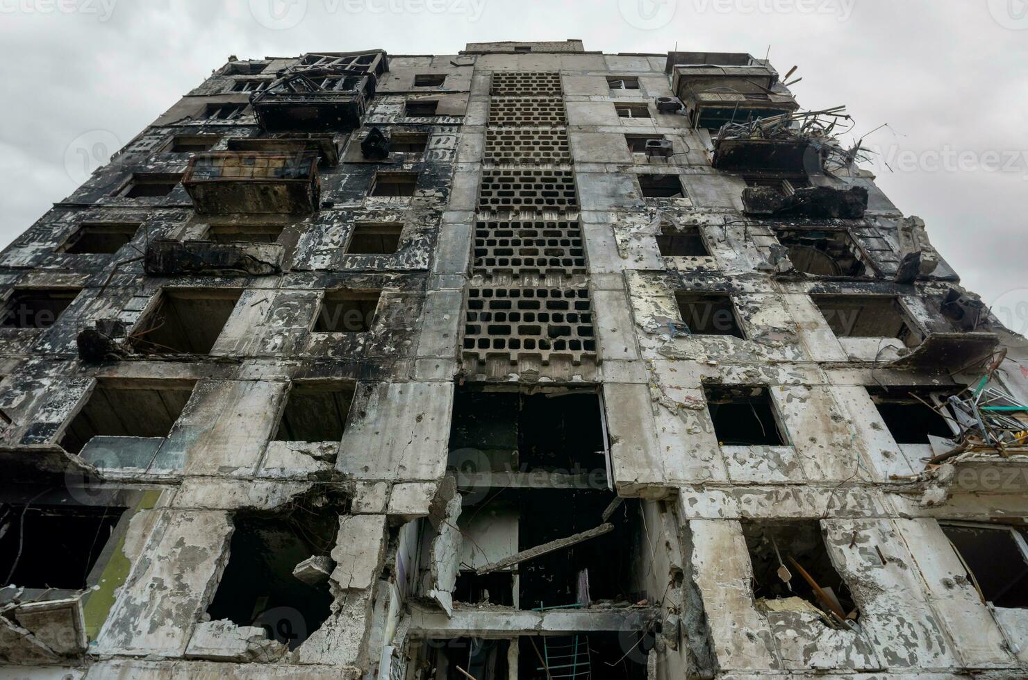 destroyed and burned houses in the city during the war in Ukraine photo