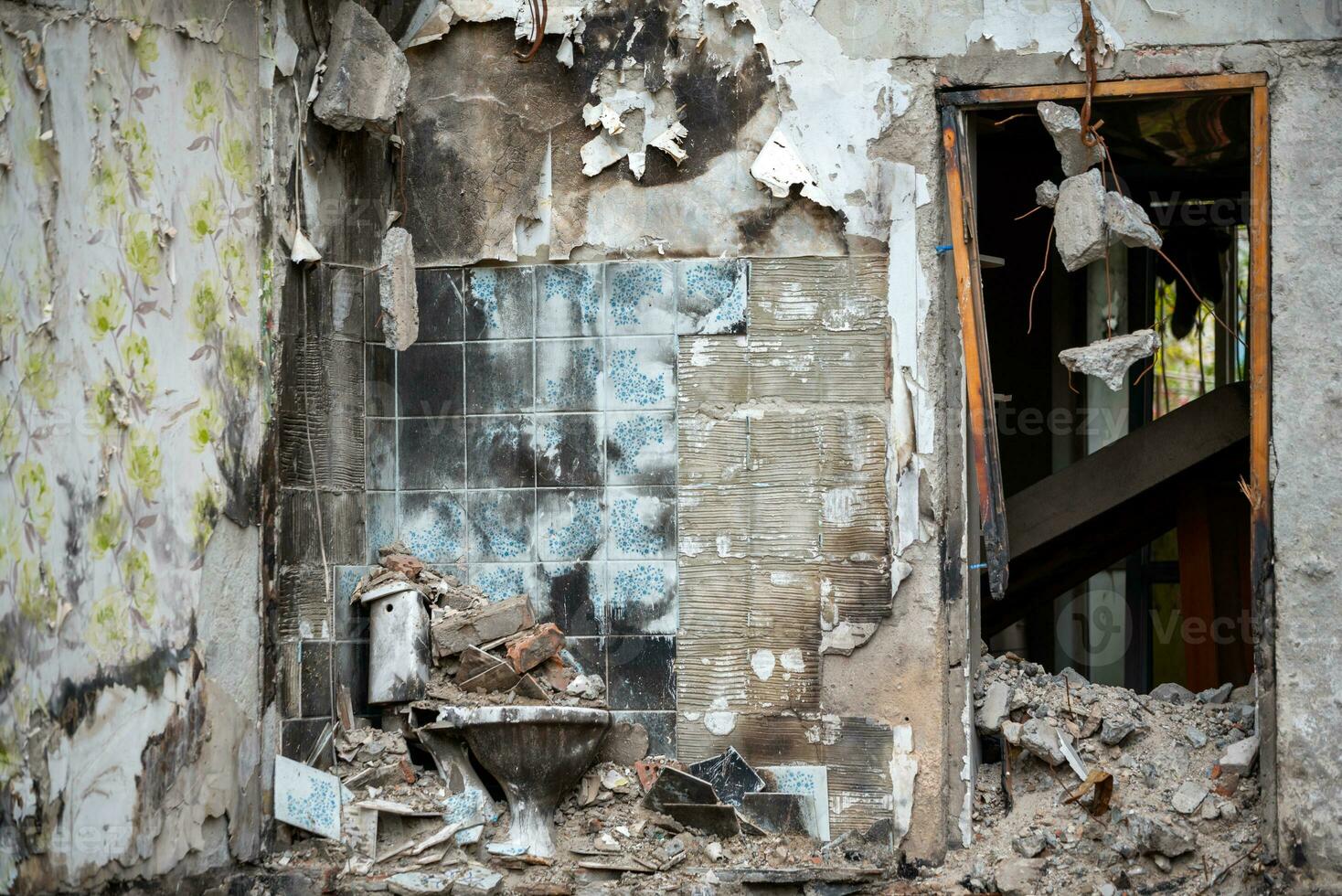 destroyed and burned houses in the city during the war in Ukraine photo