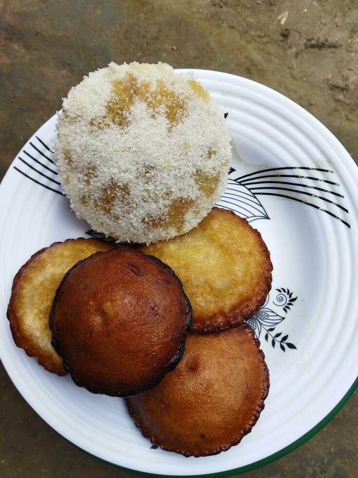 The joy of Pithapuli is the identity of Bengalis. The village home begins with the taste of pithapuli, making steamed pitha and oil pitha in the Gharua method photo