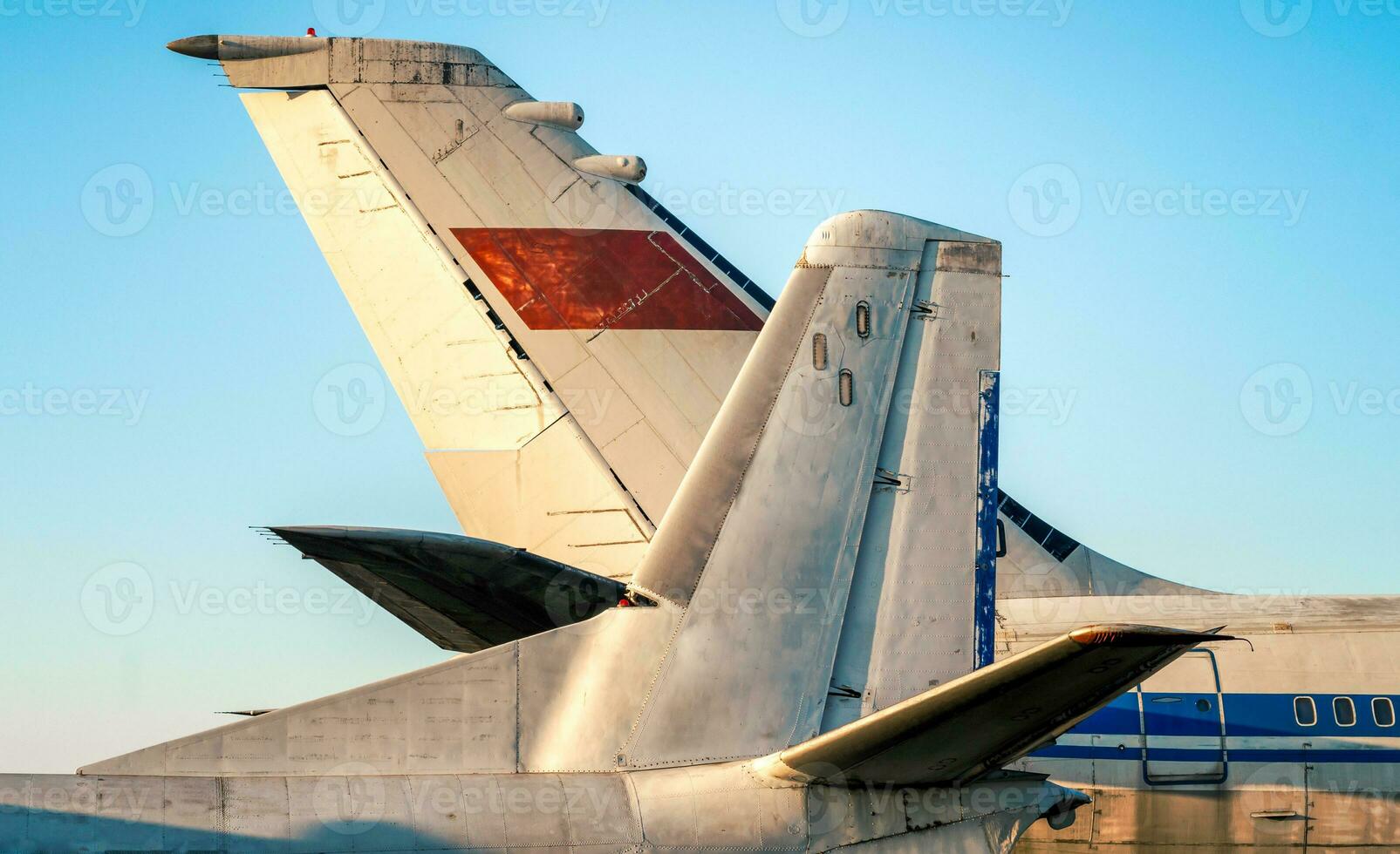 tail and wings of large old airliners with the symbol of the Soviet Union photo