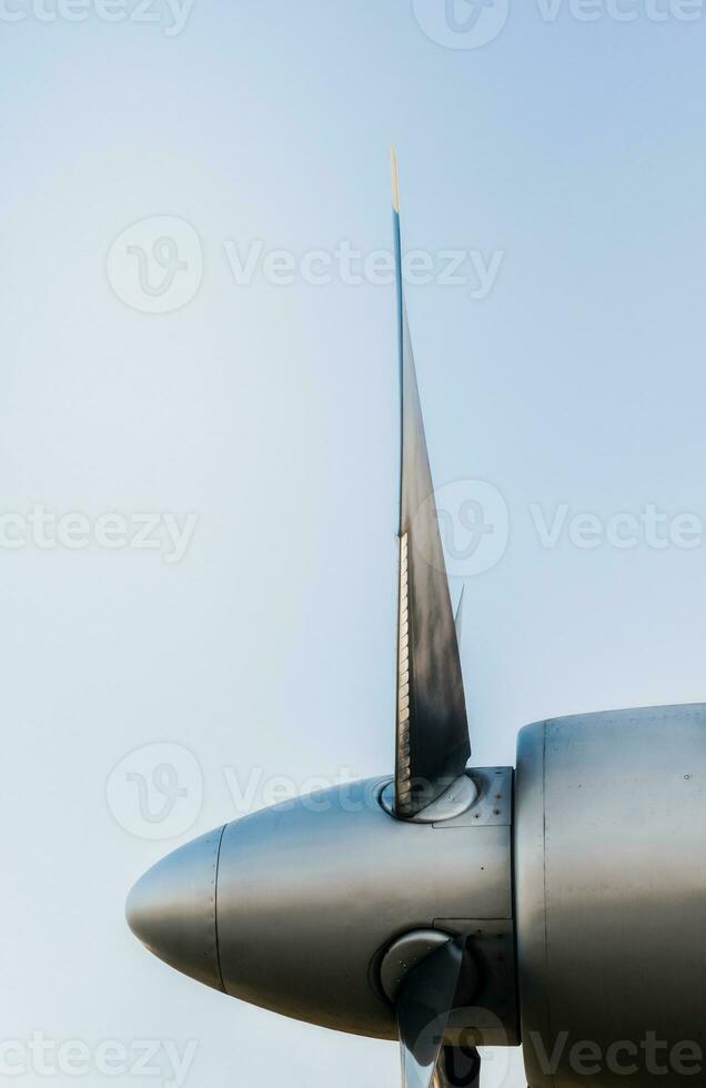 airplane propeller blades on blue background close up photo
