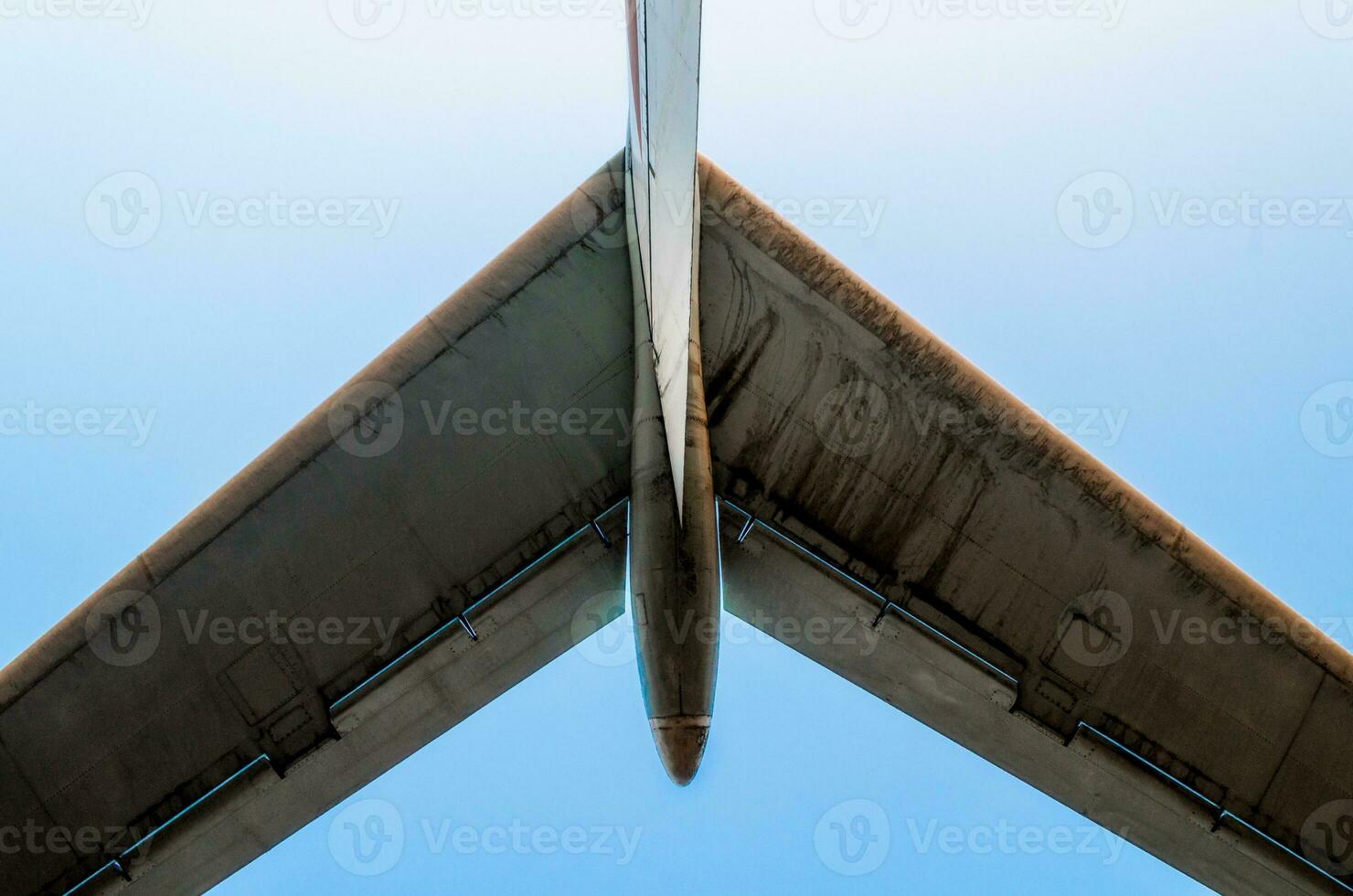 wings of a large airliner on a blue background photo