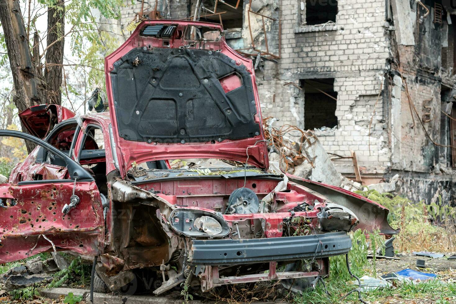 damaged and looted cars in a city in Ukraine during the war photo