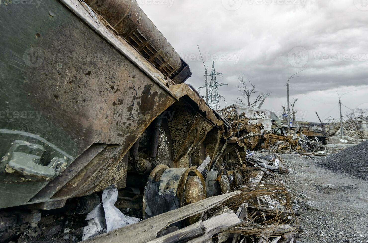 burnt tank and destroyed buildings of the Azovstal plant shop in Mariupol photo