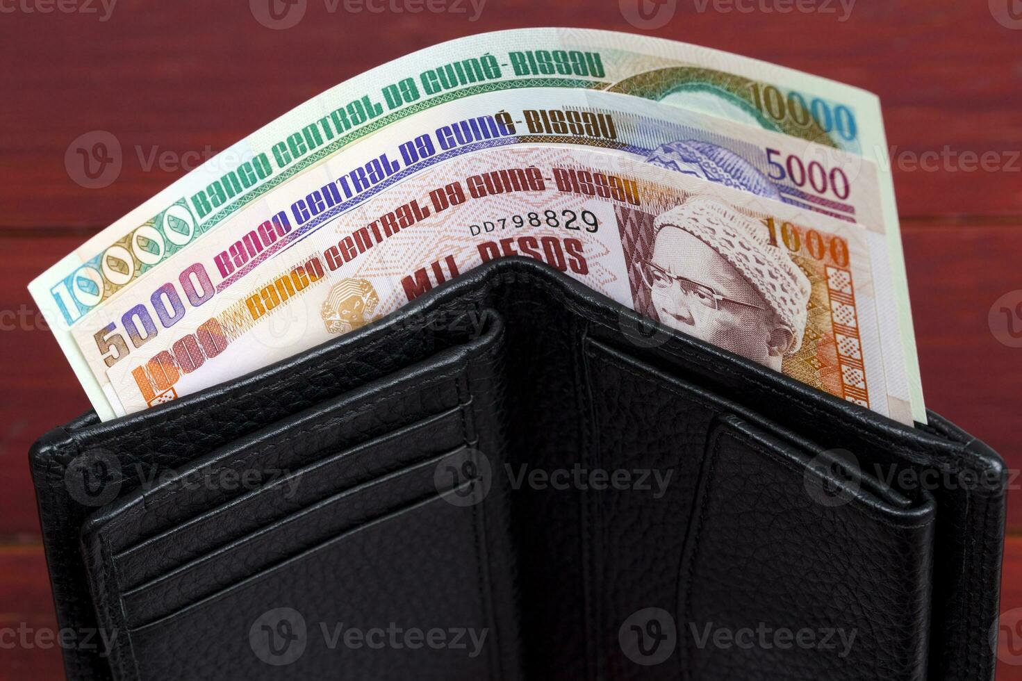 Guinea-Bissau peso in the black wallet photo