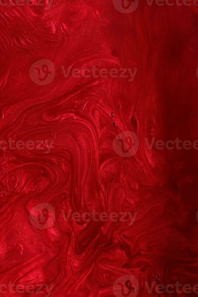 Vertical red shimmer abstract background. Make up concept.Beautiful stains of liquid nail laquers.Fluid art,pour painting technique.Horizontal banner,can be used as backdrop for chat. photo