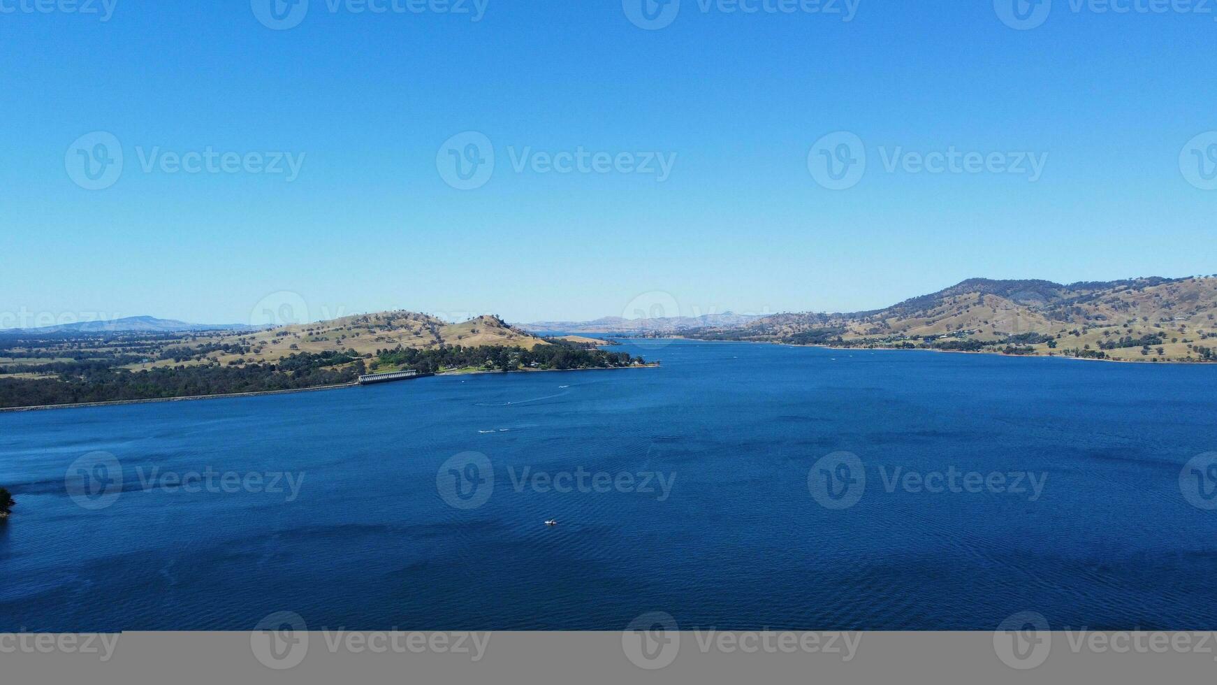 Aerial view of Jacksons point Bonegilla Victoria Australia with mountain view and lake hume water held by an awe-inspiring dam wall. photo
