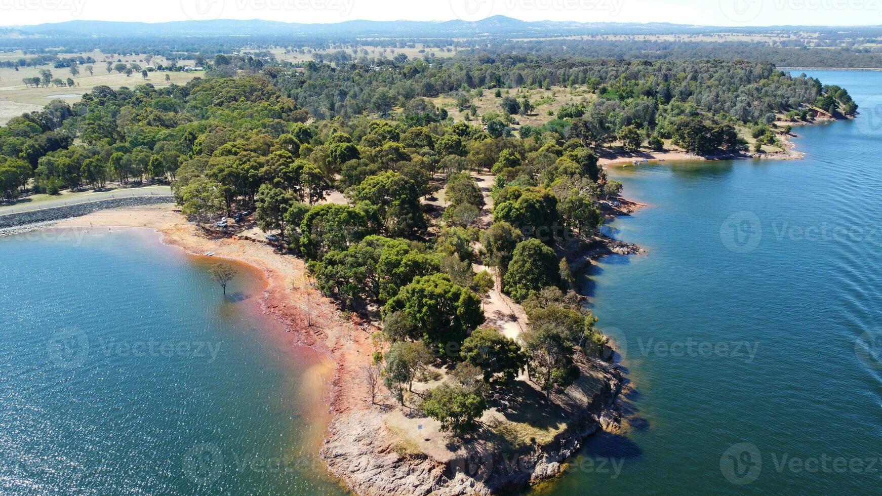 Aerial view of Jacksons point Bonegilla Victoria Australia with mountain view and lake hume water held by an awe-inspiring dam wall. photo