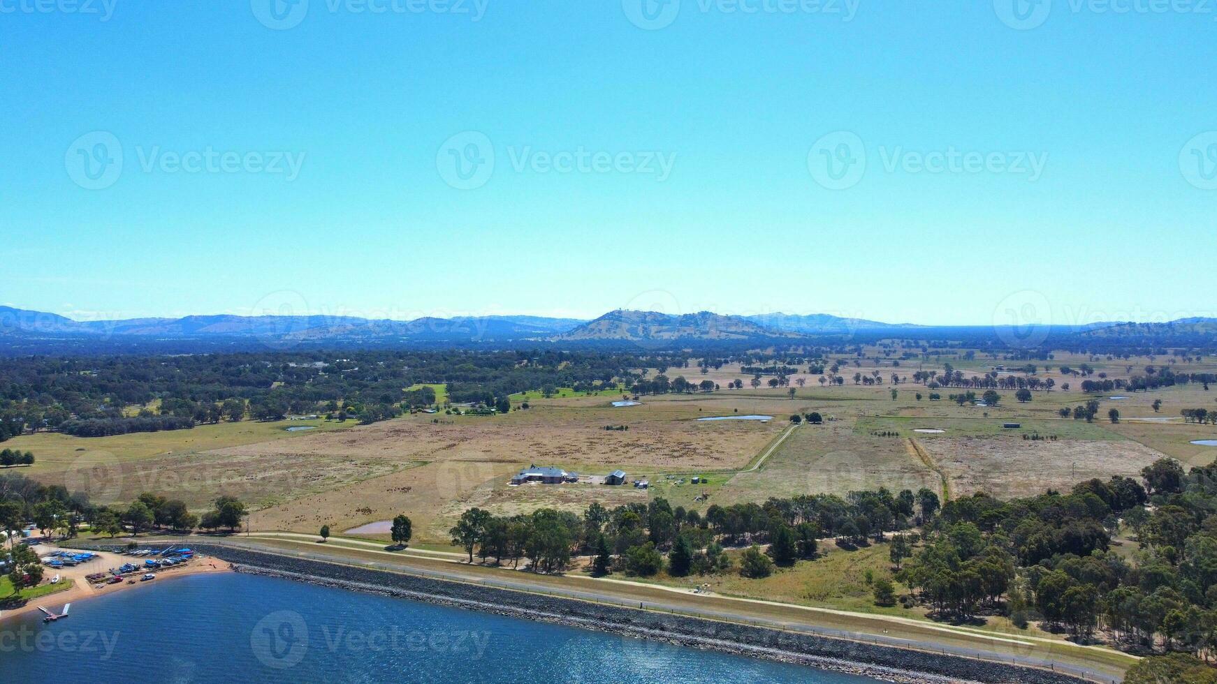 Aerial view of Jacksons point Bonegilla Victoria Australia with mountain view and lake hume water held by an awe-inspiring dam wall. photo