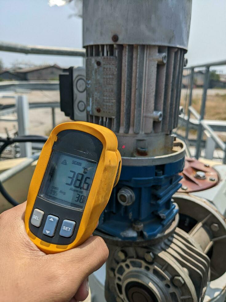 Check temperature of body motor agitator of sludge clarifier photo