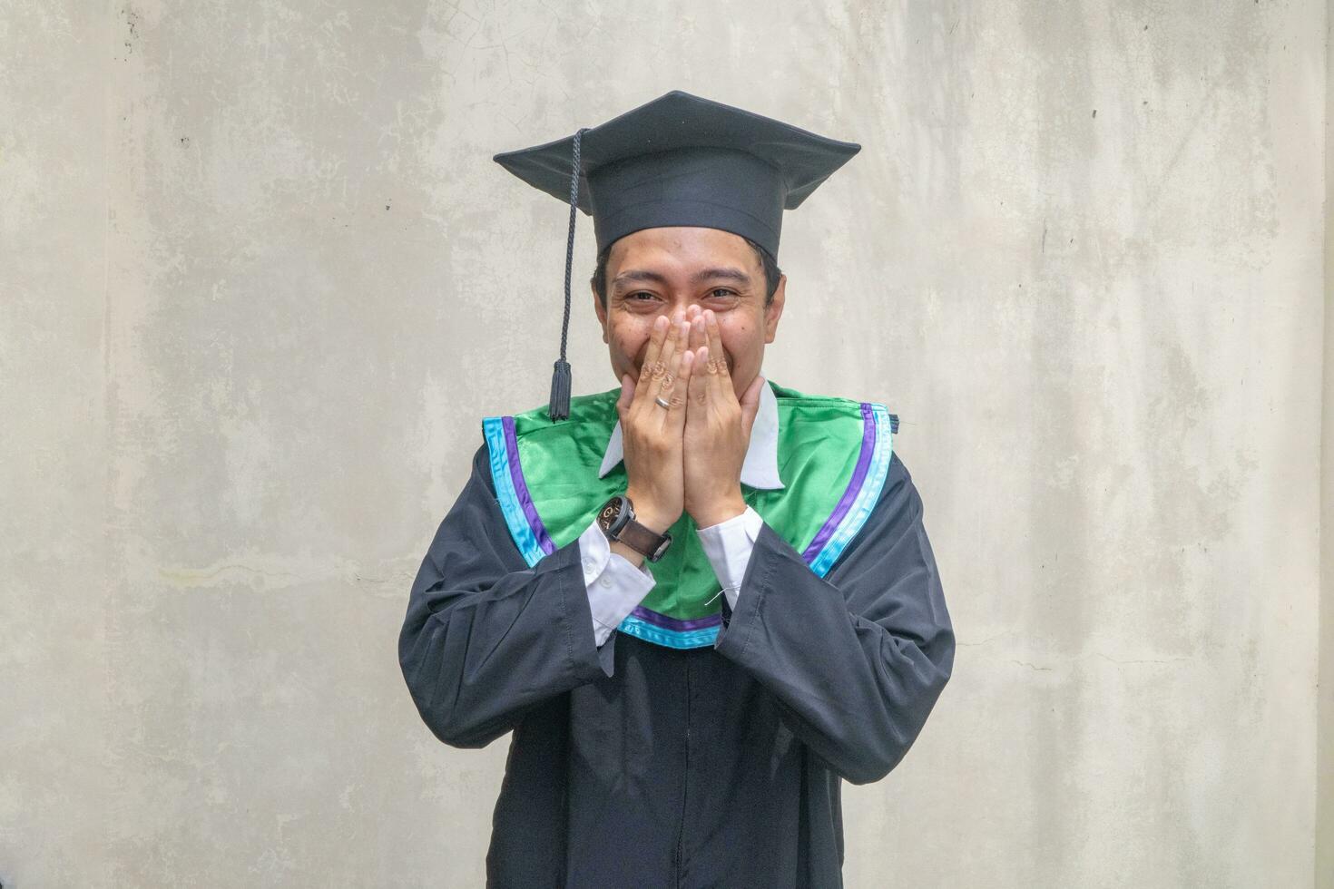 Young Indonesian guys celebration and cheers when graduation moment. photo