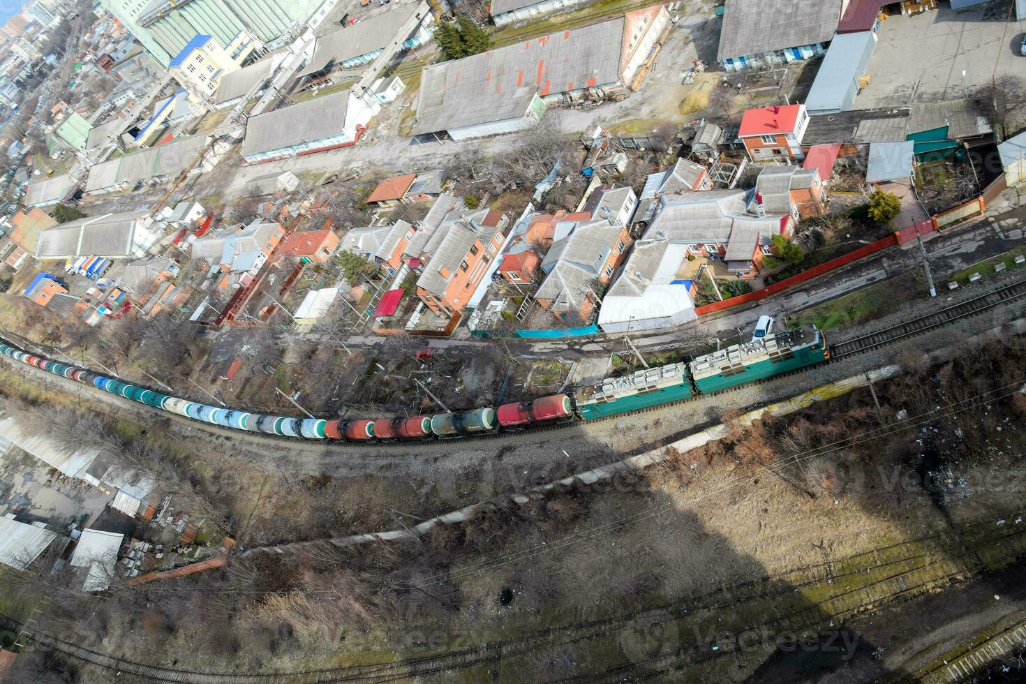 Freight train traveling through the city buildings. photo