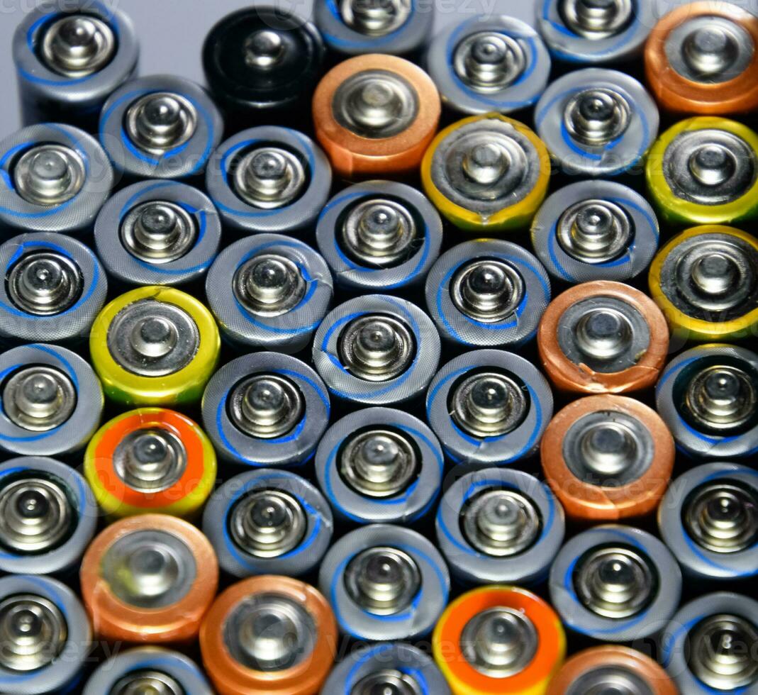 Salt and alkaline batteries, source of energy for portable technology. AAA and AA batteries photo