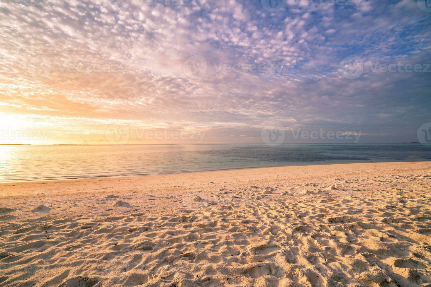 Closeup sea sand beach. Panoramic beach landscape. Inspire tropical beach seascape horizon. Orange and golden sunset sky calmness tranquil relaxing sunlight summer mood. Vacation travel holiday banner photo
