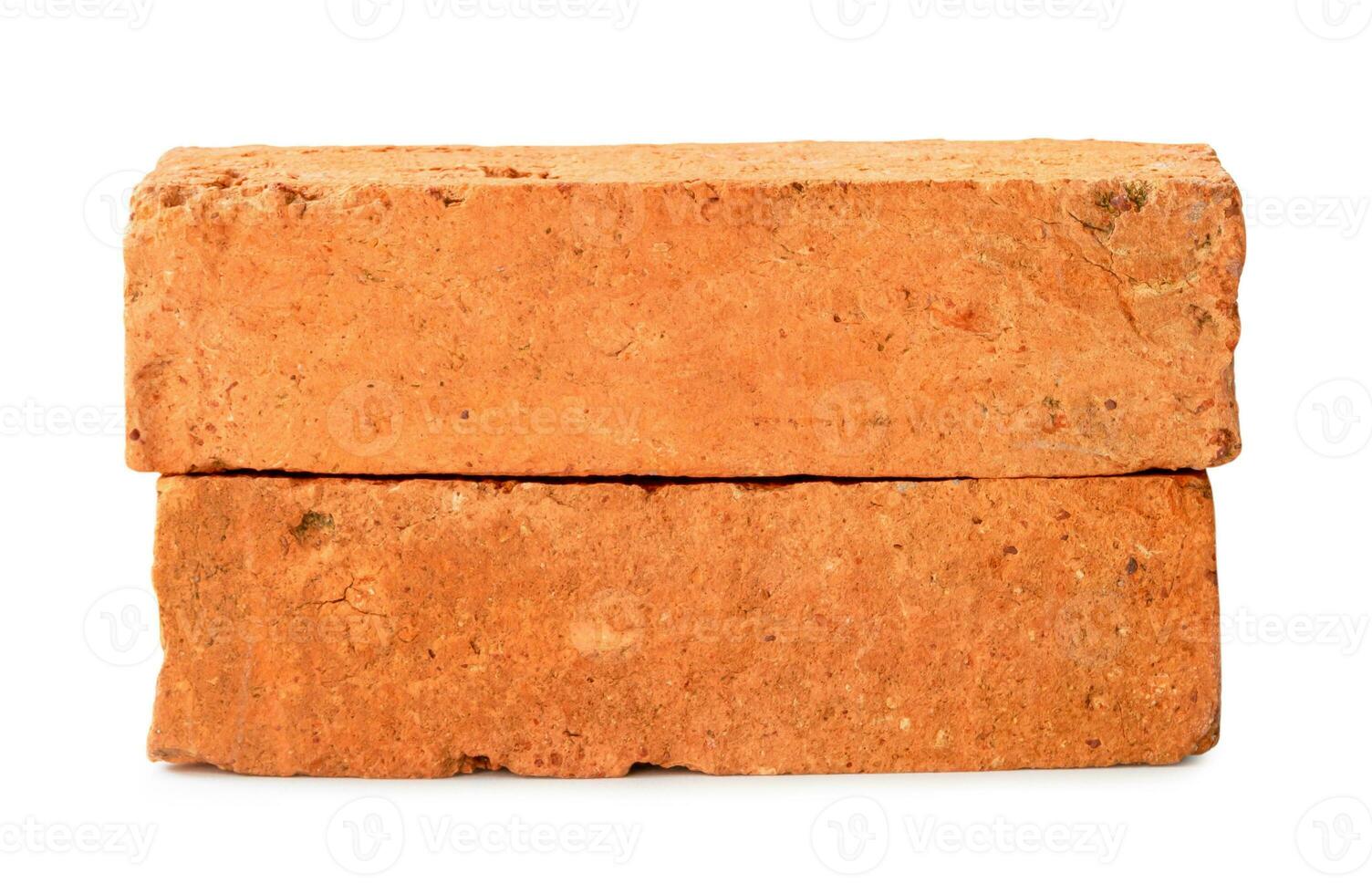 Front view of old red or orange cracked bricks in stack isolated on white background with clipping path photo