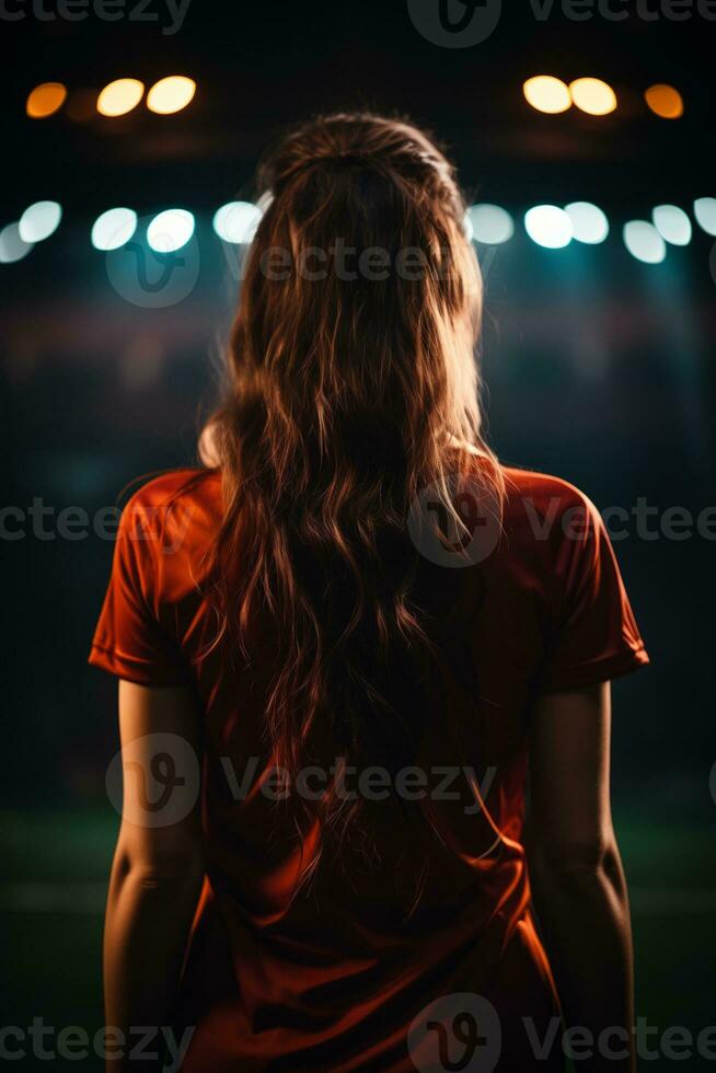 AI generated a girl watching soccer on an empty stadium at night photo