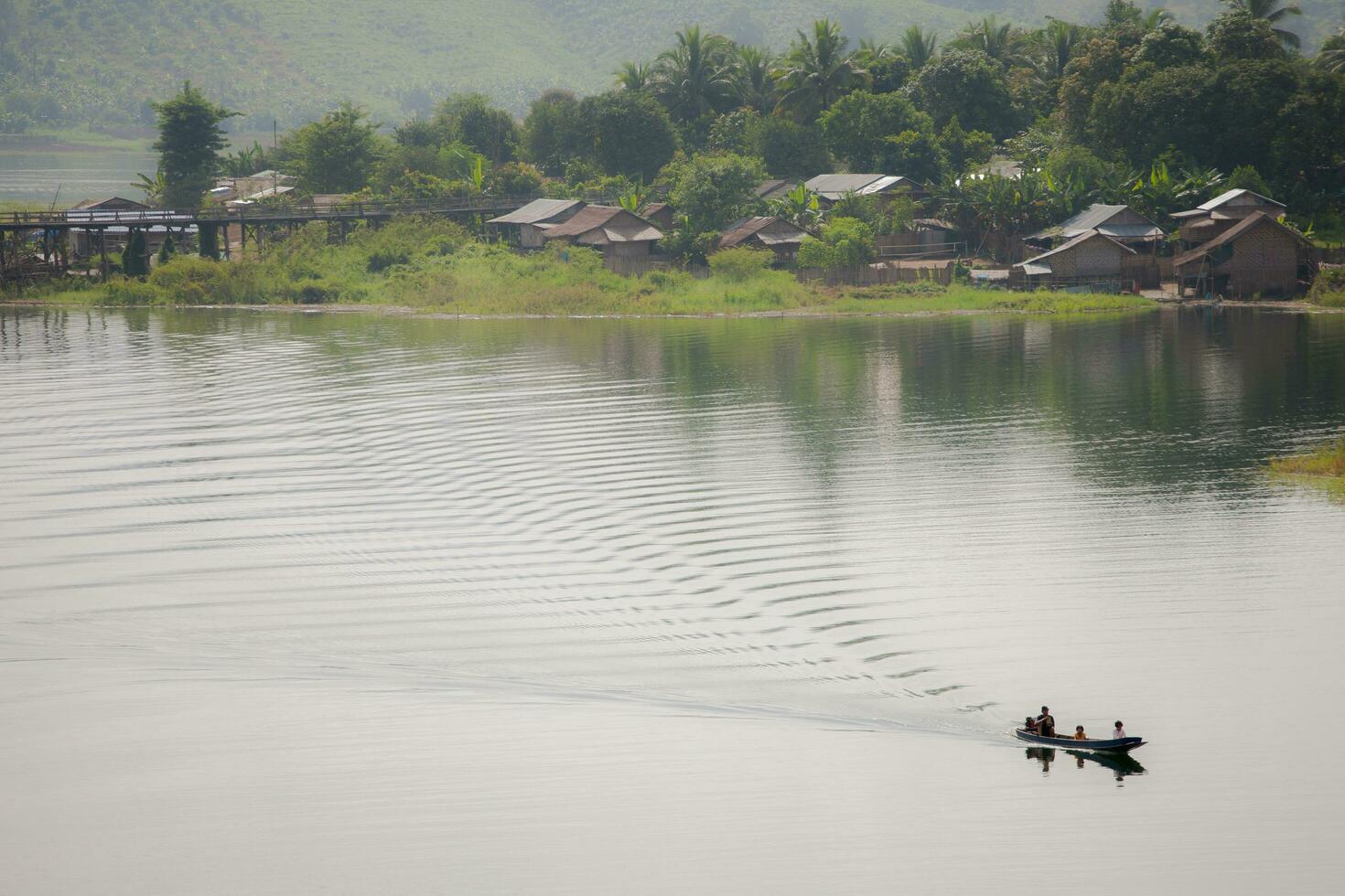 boat across moving in dam photo