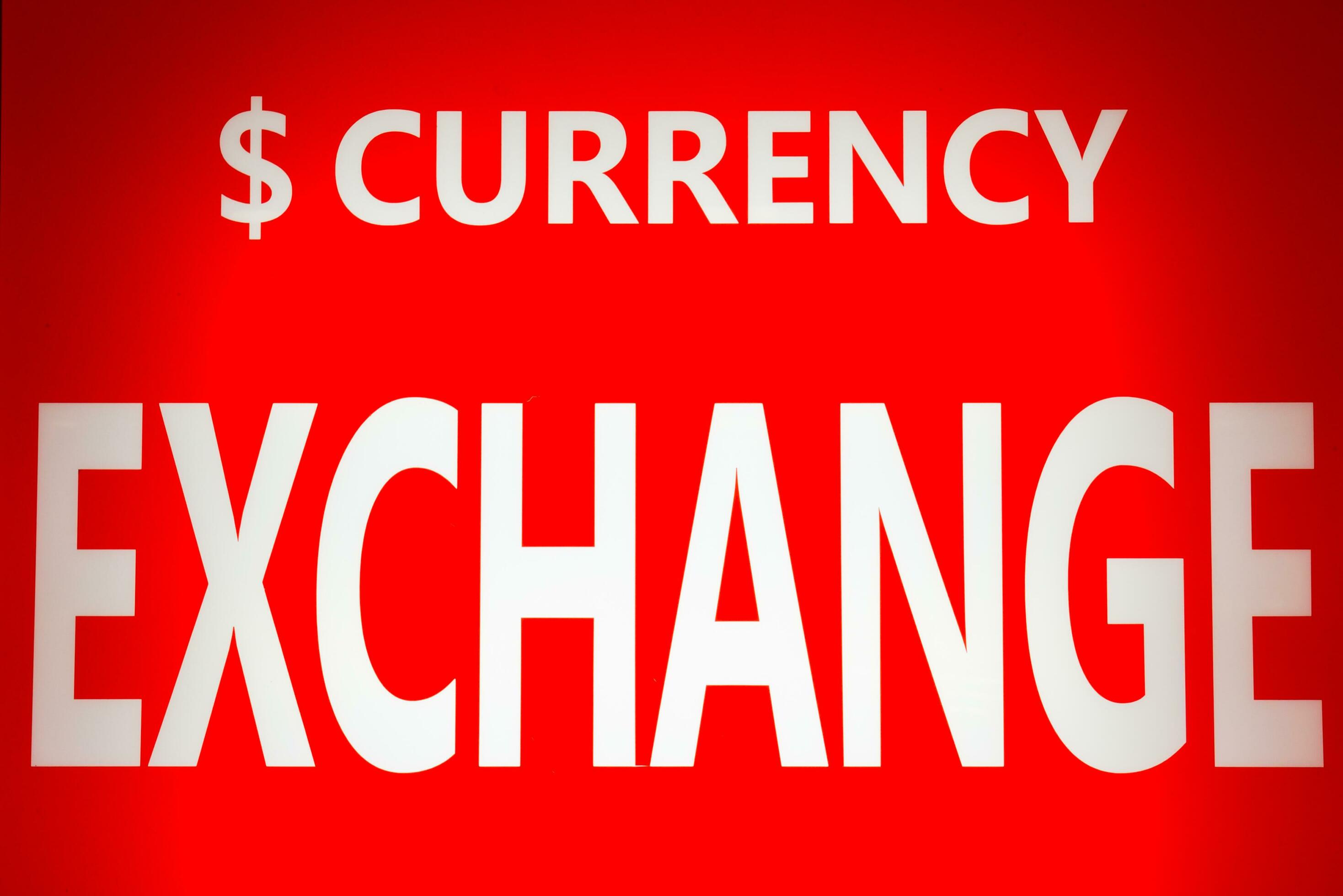 Exchange currency white text on red background 36191930 Stock Photo at