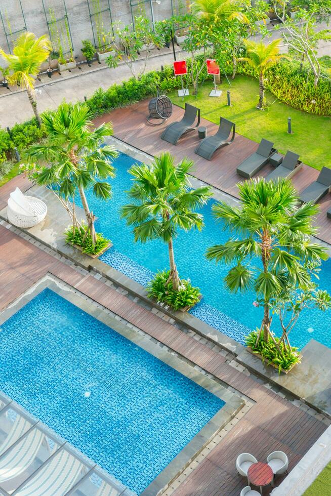 Swimming pool out door with green grass field photo