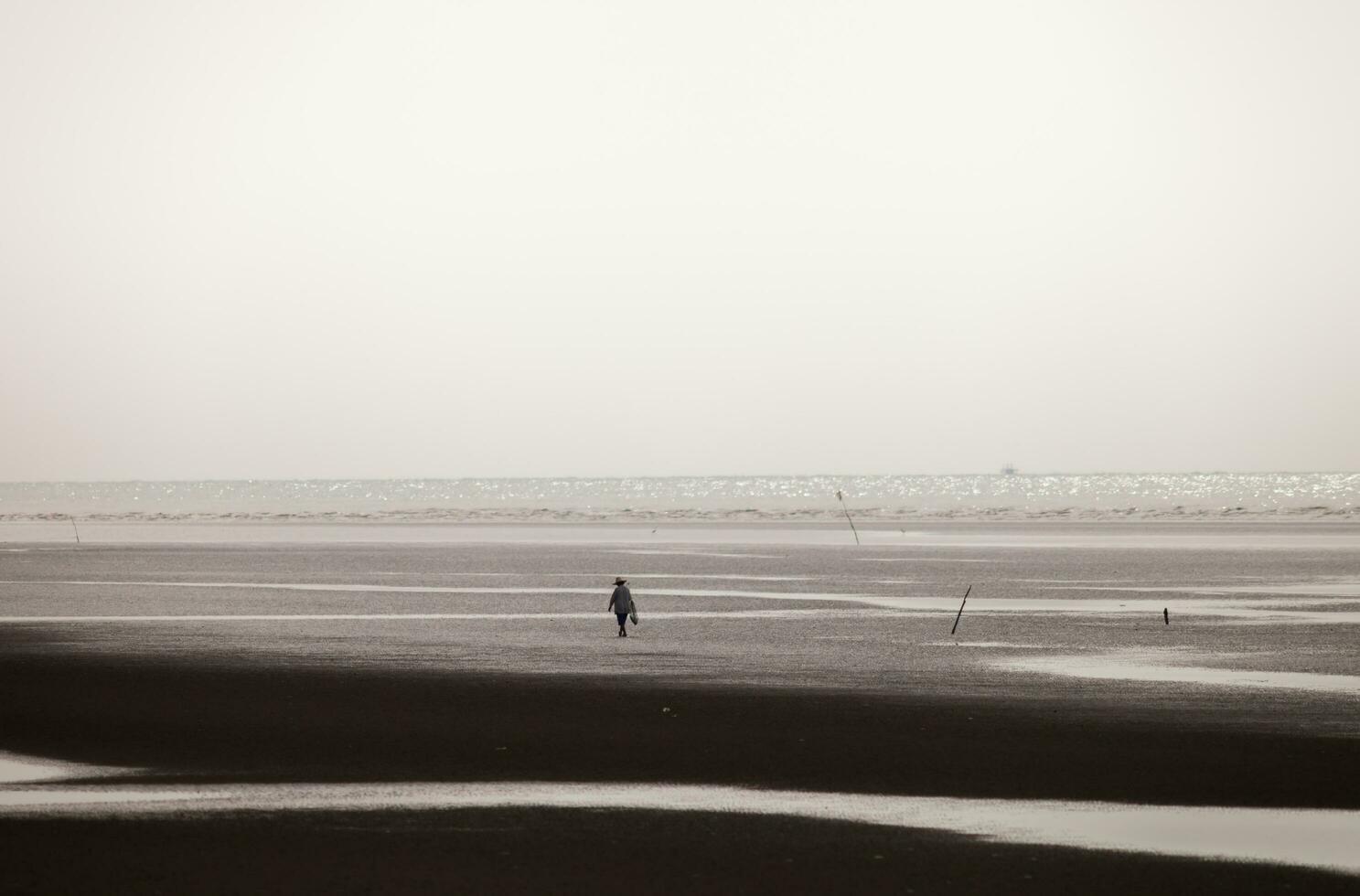 Man walk to the beach photo