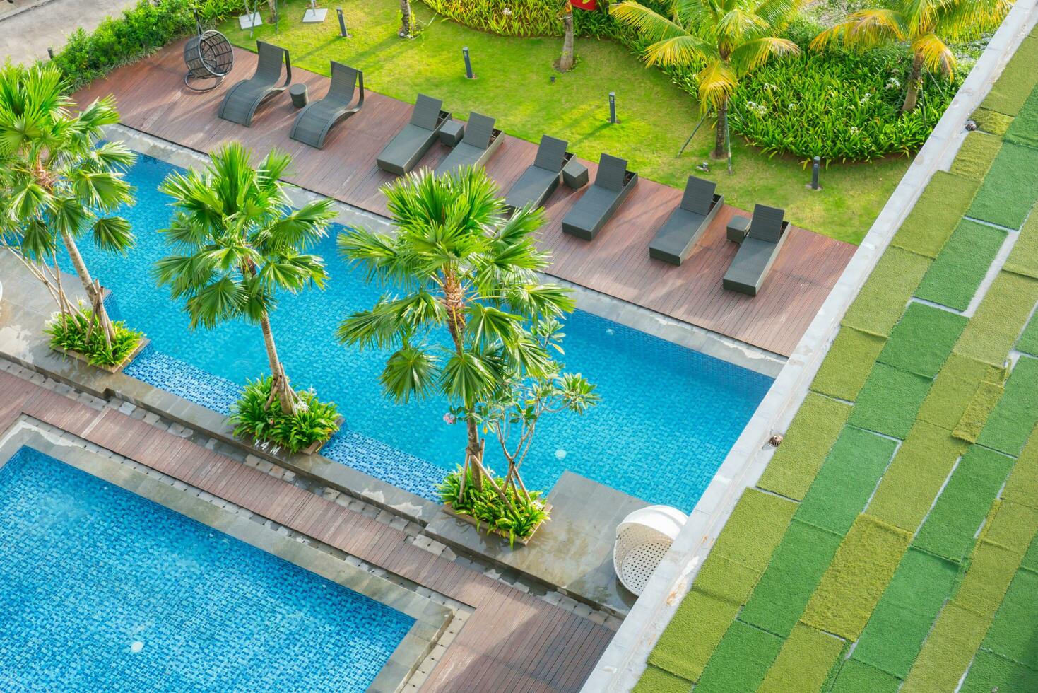 Swimming pool out door with green grass field photo