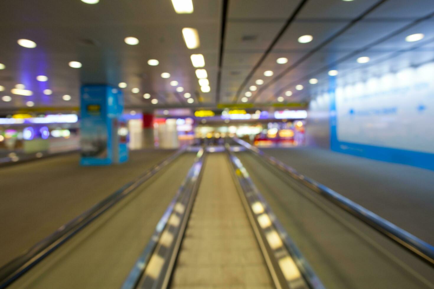 walk way inside terminal building of airport photo