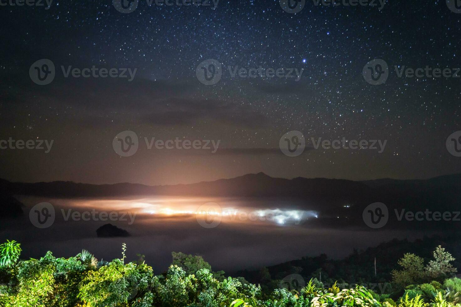 Milky way and star at nigh time above mountain photo