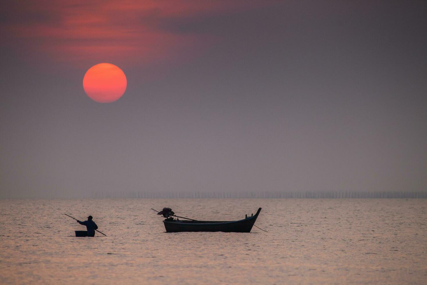 boats is floating under colorful sky photo