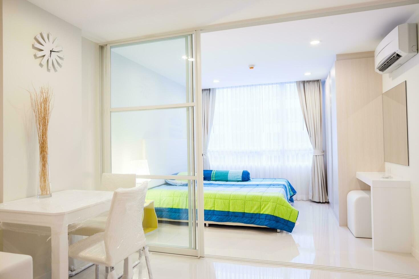 Modern condominium living room and bedroom photo