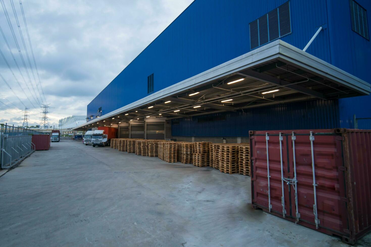 Truck is carrying container parking in front warehouse photo